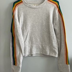 Grey crew sweater with retro stripes down arms